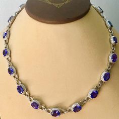 For Sale on 1stdibs - This extraordinary Necklace is consist of 19 Fine oval Tanzanite weighing approximately 47 Carats. There are total of approximately 8.5 carats of shimmering Formal Round Diamond Necklace With Gemstones, Formal Oval Necklace With 17 Jewels, Formal Round Sapphire Necklaces, Formal Oval Necklaces With 17 Jewels, Luxury Oval Diamond Necklace For Formal Occasions, Dazzling Sapphire Necklace For Formal Occasions, Formal Sapphire Necklace With Diamond Accents, Oval Hallmarked Diamond Necklace In Fine Jewelry Style, White Gold Tanzanite Necklace For Formal Occasions