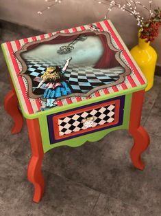 a brightly colored table with a painting on it