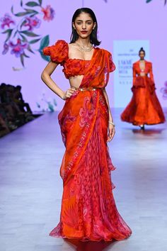 Pre draped saree with blouse. FABRIC: Organza, Cotton Lycra COLOR: Orange NO. OF COMPONENTS: 2 DELIVERY TIME: 4 Weeks WASH CARE: Dry clean Lakme Fashion Week Saree, Pre Draped Saree, Ruffled Saree, Latest Saree Trends, Orange Drapes, Lehenga Style Saree, Indian Bridesmaid Dresses, Draped Saree