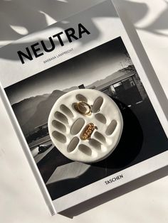 a brochure with two rings on it sitting on top of a white table