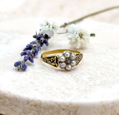 HOLIDAY SHIPPING UPDATE: Please reach out if you'd like me to add expedited shipping before you purchase and I can adjust prices as needed. Happy Holidays & Thank you for visiting us! -Lillian Here is a fantastic and rare antique early Victorian/Late Georgian mourning ring from the early 1800's. The face of the ring features a delicate pearl forget me not flower set masterfully set atop a 14K solid yellow Gold Band. The pearls are bright and lovely, especially for being over 100 years old. The c Antique Style Round Enamel Wedding Ring, Heirloom Engraved Enamel Wedding Ring, Victorian Enamel Ring For Anniversary, Antique Gold Enamel Wedding Ring, Antique Gold Enamel Ring For Wedding, Heirloom Enamel Ring With Rose Cut Diamonds For Wedding, Heirloom Engraved Enamel Ring For Wedding, Heirloom Style Engraved Enamel Wedding Ring, Victorian Rings With Historical Design For Ceremonial Occasion