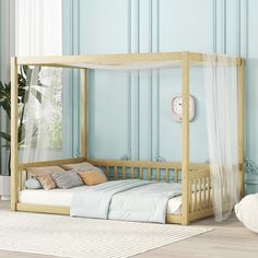 a bed with a white canopy over it in a room that has blue walls and wooden floors