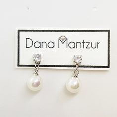 "Minimalist pearl earrings, Refined dainty bridal earrings, Cubic zirconia and round pearl wedding earrings Small and delicate bride earrings that you'll feel comfortable with as their tenderness will comply with any headpiece. Length: 0.75\" inch (1.8 cm) Item will arrive in a beautiful gift box with my brand logo, ready for gift giving, even to yourself :) Materials: * high quality of coating, Nickel free coating and white round pearl. * Care instructions: My jewelry is made by me with great c White Dainty Cubic Zirconia Bridal Earrings, Dainty White Cubic Zirconia Bridal Earrings, Delicate Pearl Earrings With Cubic Zirconia For Gift, Delicate Cubic Zirconia Pearl Earrings For Gift, Dainty Pearl Earrings With Cubic Zirconia For Formal Occasions, Dainty White Diamond Earrings For Wedding, Pearl Charm Cubic Zirconia Earrings For Gift, Wedding White Gold Pearl Diamond Earrings, Classic Hypoallergenic Diamond Earrings For Wedding