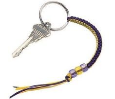 a keychain that is made out of braiding and has a metal hook on it