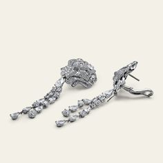 Chanel Lion Royal Earrings, Medium Version, White Gold, Diamonds Details 18k White Gold 1 Pear Cut Diamond .75cts (E-VVS2) 1 Pear Cut Diamond .75cts (F-IF) 28 Fancy Cut Diamonds 6.77cts (F+ - VVS+) 472 Round-Cut Diamonds 4.03cts (F-G - VVS1/2) *Comes with original box and certificate. *These Chanel earrings are unique. UK retail £175,000 with vat. UK retail £145,000 without vat.Product Number: J60875 Luxury Diamond Cluster Earrings With Baguette Diamonds, Luxury Diamond White Platinum Cluster Earrings, Luxury Platinum Cluster Earrings In Diamond White, Luxury Platinum Baguette Diamond Earrings, Luxury White Gold Cluster Earrings With Baguette Diamonds, Luxury Platinum Diamond Earrings With Baguette Diamonds, Luxury Baguette Diamond Earrings For Formal Events, Luxury Formal Diamond Earrings With Brilliant Cut, Luxury Diamond Cluster Earrings For Formal Occasions