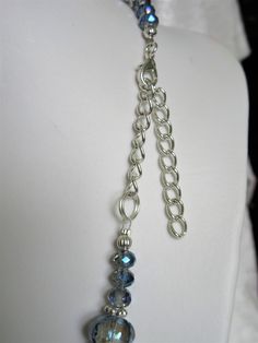 "Pale blue gray crystals were used to make this necklace. The largest is 1\" x 3/4\" x 1/4\" thick. The smallest are 4x6mm. The spacers are silver plated rondelles. A 3\" extender is included. The earrings, made with slightly more than 1/2 inch flat rounds, dangle 1\" from the loops of the silver plated ear wires. All metals are silver plated. This set will be slipped into an organza bag and shipped in a bubble mailer." Silver Crystal Costume Jewelry Necklaces, Silver Beaded Necklace With Dangle Faceted Beads, Silver Beaded Necklace With Faceted Dangle Beads, Silver Faceted Beaded Jewelry, Silver Sterling Silver Beaded Necklace With Adjustable Chain, Silver Jewelry With Faceted Round Beads, Silver Sterling Silver Necklace With Round Beads, Adjustable Crystal Necklace Nickel Free, Silver Wire Wrapped Crystal Jewelry