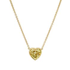 Drape yourself in luxury with our Certified 18k Yellow Gold Heart Shape Yellow Diamond Pendant. This exquisite piece features a captivating yellow diamond meticulously crafted into a heart shape, symbolizing love and opulence. Set in radiant 18k yellow gold, the pendant adds a touch of warmth and sophistication to any ensemble. The diamond is certified for its exceptional quality, ensuring enduring beauty. Luxury Yellow Gold Heart-shaped Diamond Necklace, Yellow Gold Heart Cut Gemstone Necklace, Yellow Gold Heart Necklace With Gemstone, Yellow Gold Gemstone Heart Necklace, Luxury Yellow Necklaces For Anniversary, Luxury Yellow Gold Heart Cut Necklace, Heart Shaped Yellow Gold Necklace With Single Cut Diamonds, Yellow Gold Gemstone Heart Necklace For Anniversary, Fine Jewelry Yellow Gold Heart Cut Necklace