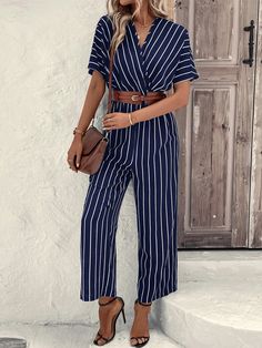 This stylish Striped Print Batwing Sleeve Jumpsuit is perfect for a day out. Featuring a wrap design and long length, it has a striped pattern in blue color that will add a touch of fun to any outfit. With a V-neck, short fluttery batwing sleeves, and a regular fit, this shirt is sure to be a staple in your wardrobe. Specifications: Style: Casual Pattern Type: Striped Details: Wrap Length: Long Type: Shirt Fit Type: Regular Fit Neckline: V neck Sleeve Length: Short Sleeve Sleeve Type: Batwing Sleeve Waist Line: High Waist Fabric: Non-Stretch Material: Woven Fabric Composition: 100% Polyester Care Instructions: Machine wash or professional dry clean Size Chart(cm): Size US Bust Cuff Hip Size Inseam Length Sleeve Length Thigh Waist Size S 4 90 34.5 105 62.5 139 37 67 64-98 M 6 94 35.9 109 63 Comfy Jumpsuits, Jumpsuit With Sleeves, Batwing Sleeve, Bat Wings, Stripe Print, Long Length, Sleeve Type, Woven Fabric, Types Of Sleeves