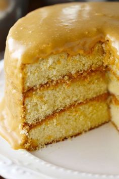 a close up of a cake on a plate with a slice cut out of it