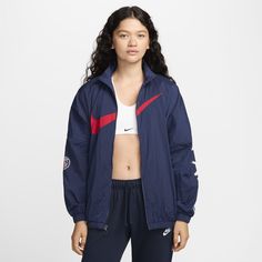 Rep your favorite team in this PSG jacket. An oversized fit and a mesh lining make it perfect for layering, while elastic at the waist and cuffs help keep it in place as you move through your day. Nike Outerwear For Sports Events In Fall, Nike Fall Outerwear For Sports Events, Nike Windbreaker For Winter Sports Events, Nike Winter Windbreaker For Sports Events, Nike Functional Outerwear For Sports Events, Nike Outerwear For Sports Events, Nike Sporty Outerwear For Sports Events, Navy Athleisure Track Jacket For Winter, Sporty Navy Outerwear For Sports Events