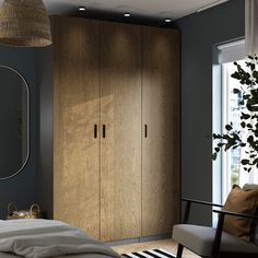 a bedroom scene with focus on the armoire and bed