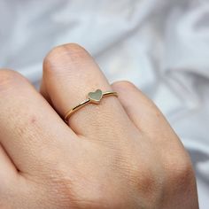 14K Solid Gold Dainty Heart Promise Ring for Her 🌟 Product Features: ⚖️ Weight: 1.05 Grams 🌈 Material Colors: Available in Yellow Gold, Rose Gold, and White Gold 🎁 Presentation: Shipped with a special box and bag, perfect for gifting 🔄 Returns: Right to return within 7 days ✨ Material and Color: Designed to never fade or darken 🛠️ Handcraftsmanship and Uniqueness: Handcrafted with love, may vary by 5% (+-) Give a heartfelt token of love with the 14K Solid Gold Dainty Heart Promise Ring. Thi Dainty Gold Heart Ring For Promise, Dainty Heart Ring With Simple Design For Promise, Dainty Simple Design Heart Promise Ring, Minimalist Stackable Rings With Heart Charm For Promise, Dainty Stackable Midi Rings For Valentine's Day, Minimalist Heart Shaped Stackable Promise Rings, Dainty Stackable Heart Ring Gift, Dainty Heart-shaped Stackable Rings For Anniversary, Dainty Stackable Gift Rings With Heart Charm