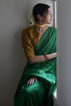 Teej green saree crafted in bangalore silk base, highlighted with hand embroidered buttis and lace trim. Paired with a gold blouse with hand embroidered motifs on the sleeves. - Aza Fashions Mirror Saree, Embroidered Motifs, Gold Blouse, Green Saree, Silk Saree With Blouse, Blouse Online, Sarees Online, Three Quarter Sleeves, Quarter Sleeve