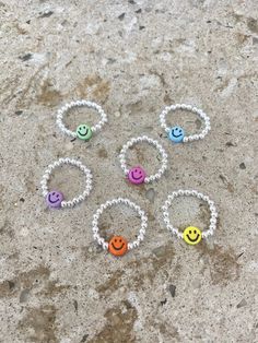 ☺ The smiley ring ☺ There is always a reason to smile ☺ The perfect gift for yourself or a loved one as a reminder to smile everyday. ☺ Made with 7mm acrylic smiley faces - choose your colour before adding to cart ☺ 3mm silver plated beads - choose your finish before adding to cart  ☺ Clear strong stretch magic cord ☺ Size ranges are US ring sizes - choose before adding to cart **Orders will be shipped to the address you have on file with Etsy/PayPal. Please check it prior to submitting an order Fun Silver Jewelry For Friendship, Playful Silver Jewelry For Friendship, Sterling Silver Friendship Ring, Friendship Sterling Silver Ring, Smiley Face Round Jewelry For Friendship, Cute Adjustable Ring For Everyday, Round Smiley Face Jewelry For Friendship, Cute Adjustable Everyday Rings, Fun Sterling Silver Jewelry In Silver