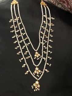 Kundan Pearl Drop Necklace For Diwali Gift, Elegant Kundan Necklace With Pearl Chain For Puja, Elegant Kundan Necklace For Puja, Bollywood Kundan Necklace With Pearl Drop For Gifts, Pearl Drop Necklace For Diwali Party, Bollywood Style Bridal Pearl Necklace Gift, Diwali Party Pearl Drop Necklace, Elegant Kundan Pearl Necklace For Puja, Kundan Pearl Drop Necklace For Gift