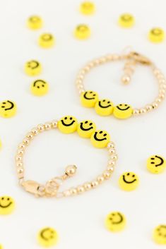 These sunny yellow smiley face beads surrounded by gold filled beads are a positive and darling accessory to highlight your child’s tiny wrist. The perfect accessory for every Mom + her mini! Made with the highest quality materials, this bracelet will look beautiful for years to come. Durable enough for play, precious enough to keep forever. Materials: 14k gold filled or sterling silver components. Nickel free. To learn more about our materials and what makes gold filled unique read here. Features: Each bracelet has a ½” extender chain to allow it to grow with your child. Guarantee: 100% satisfaction guaranteed. If you don’t love it, contact us to arrange a return/exchange. Read more about our quality guarantee here. PLEASE WATCH TEETHING BABIES CAREFULLY AS SMALL COMPONENTS CAN POSE AS A Cute Handmade Gold Beaded Bracelets, Playful Gold Beaded Bracelets For Everyday, Smiley Face Round Beads Bracelet For Gift, Smiley Face Round Beads Bracelet As Gift, Hypoallergenic Gold Beaded Bracelets For Birthday, Cute Gold Beaded Bracelets For Birthday, Adjustable Playful Gold Jewelry, Personalized Fun Gold Bracelets, Playful Smiley Face Jewelry For Gifts