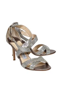 Sparkle and shine in these metallic Jimmy Choo strappy sandal heels! Featuring a glitzy design, they're the perfect match for any beaded cocktail dress or jazz up your skinny jeans with a touch of sparkle and a dazzling handbag! Size 6 (IT 36) Made in Italy Glitter-covered leather upper Strappy design with buckle closure Leather footbed Leather sole Heel 3.5"