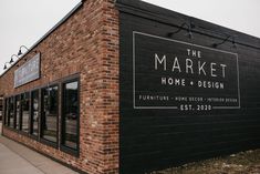 the market home and design is located on an old brick building