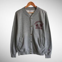 "CODE : O/4 Vintage Greenville Football Varsity Grey Sweatshirt Green Ville American Football Crewneck Green Ville Football Sweater Pullover Ncaa Jumper Size on Tag : M Details Measurement  Arm Pit to Arm Pit : 22\"inches Back Collar to Hem : 27\"inches Condition :  Great Condition.Minor stains defect,discoloration and holes please refer pictures detail.‼️ 📮 SHIPING > WE ARE USING DHL EXPRESS SHIPING ITS TAKE 3-5 ARRIVE.PLEASE DROP YOUR PHONE NUMBER AFTER PURCHASE.📮" Winter Cotton Varsity Jacket With Crew Neck, Gray College Style Sweatshirt For Fall, Gray Fall Sweater For College, College Style Long Sleeve Sweater With Ribbed Cuffs, Collegiate Long Sleeve Cardigan For College, Cotton Crew Neck Varsity Jacket For Fall, Casual Gray Varsity Jacket For Fall, Long Sleeve Collegiate Cardigan For College, Gray Long Sleeve College Sweater