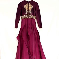 a purple dress with gold accents on it