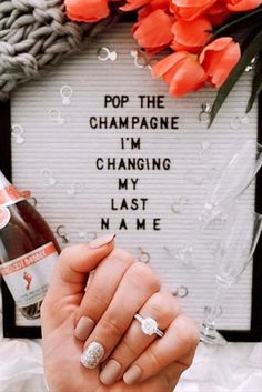 a person holding a beer in their hand with the words pop the champagne i'm changing my last name