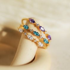 M A R Q U I S E ∙ B I R T H S T O N E ∙ R I N G  Your ultimate stacking ring has arrived! Our Triple Marquise Birthstone Ring allows you to customize to the stone you want. With delicate CZ Diamond gemstones in between each marquise birthstone, this ring shines with even more sparkle. * Material: High Quality Solid 925 Sterling Silver  * Finish: Sterling Silver ∙ 18K Gold ∙ Rose Gold  * Featuring a ~1mm Dainty Ring Band with three ~3.5 x 2mm Marquise Gemstones and ~1mm Round CZ Diamond Stones. ♡ Custom Gemstone Rings, Initial Tag Necklace, Dainty Initial Necklace, Marquise Ring, Mother Rings, Anniversary Jewelry, Jewelry Birthday, Birthday Jewelry Gift, Birthday Gift For Her