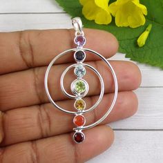 Amethyst, Iolite, Blue Topaz, Citrine, Peridot, Carnelian, Garnet Pendant, 925 Silver Pendant, Mothers Gift, Huge Shape Pendant, N010316 Metal - Solid 925 Sterling Silver Gemstone - Amethyst, Iolite, Blue Topaz, Citrine, Carnelian, Peridot Stone Size- 5mm Main Color: Multi  Weight: 8.5gram  You can use it your self or Gift it to someone. It is an ideal gift which everyone would love to get. If you want extra small or extra large let me know. We will make it specially for you. Brought to you excl Round Natural Gemstones For Spiritual Use, Round Natural Stone Spiritual Gemstones, Round Spiritual Natural Gemstones, Round Rainbow Stones Jewelry, Rainbow Round Stone Jewelry, Rainbow Colored Round Stone Jewelry, Sterling Silver Fusion Style Natural Gemstones, Spiritual Round Birthstone Gemstones, Multicolor Round Fusion Gemstones