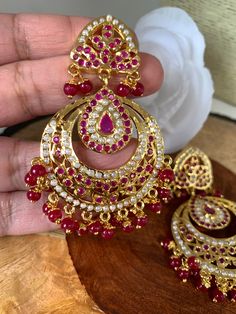 Hyderabadi Jadau Pearls Red Stone Chandbali EarringsColor : GoldenSize : Earring Length : 3 Inches; Weight : 17 Grams Each;Stones : Red Stone Pearls Simple Mehndi Dresses, Mehndi Dresses, Chandbali Earrings, Traditional Earrings, Simple Mehndi, Red Stone, Social Events, Indian Jewelry, Stone