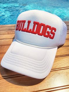 Super fun trucker hats that can be customized with your team name, mascot, phrase and more!   They are created with puff embossed print and look fantastic in our huge assortment of puff colors. Hat Colors:  All Black, All White, Black Back with White Front, Red, Navy, Khaki Closure: The back is an adjustable snap back Please List: 1. Text Style (Font 1, Font 2, Font 3, Athletic) ** please reach out first if you have a custom text or logo. 2. Text on Hat (8-10 characters) ** the more characters t Cheap Letter Print Trucker Hat For Fans, White Trucker Hat With Embroidered Logo For Sports Events, Team-colored Flat Brim Trucker Hat For Sports Events, Flat Brim Trucker Hat With Letter Print For Sports, White Trucker Hat For Game Day, White Snapback Hat With Letter Print For Sports, Flat Brim Letter Print Trucker Hat For Sports Events, White Curved Brim Trucker Hat For College, Letter Print Flat Brim Trucker Hat For Sports Events