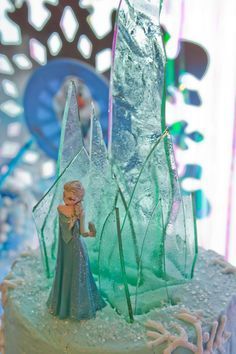 a frozen princess cake with frosting and icing