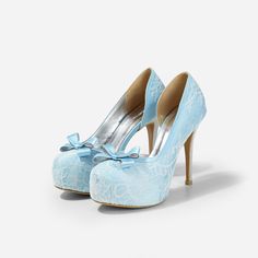 Lady Bella is a pair of custom made shoes in sweet baby blue satin. This pair of wedding heels features silky satin fabric with ivory white lace overlay. The front of this bridal heel features a dainty bow and the 4.5 inch heel of this bridal shoe is finished in silver glitter fabric. This pair of shoes is made using satin, glitter, lace, PU and other synthetic materials. They can be customized in different heel heights, colors and styles. They come with 0.5 inch elevated platform front. CUSTOMI Satin High Heel Wedding Shoes, High Heel Satin Wedding Shoes, Light Blue Round Toe Evening Wedding Shoes, Elegant Light Blue Wedding Shoes For Formal Occasion, Light Blue High Heels For Wedding, Fitted Blue Wedding Shoes, Light Blue High Heel Wedding Heels, Elegant Light Blue Closed Toe Wedding Shoes, Light Blue Closed Toe Heels For Wedding