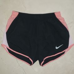 This Is A Brand New Pair Of Shorts By Nike Dri Fit. Beautiful Black And Light Pink Color Combination. Inner Drawstring Waistband For The Perfect Fit. These Will Become Your Go-To Shorts For Everyday. Made Of A Lightweight, Moisture-Wicking Fabric. So Comfortable, Classic, And Easy To Wear. "Underwear" Lining For Full Support And Coverage. Brand New In Perfect Condition. Purchased For $35+Tax. Buy It Here For A Fraction Of The Price I Paid. Please Let Me Know If You Have Any Questions! I Am Selli Sporty Pink Moisture-wicking Athletic Shorts, Pink Moisture-wicking Sportswear Shorts, Pink Sportswear Athletic Shorts For Gym, Pink Sportswear Athletic Shorts For Workout, Pink Athletic Shorts For Workout, Pink Athleisure Athletic Shorts For Running, Pink Athleisure Athletic Shorts, Casual Pink Running Shorts, Pink Go-dry Shorts For Gym