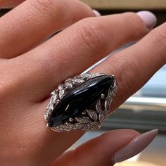 This Beautiful Cocktail Ring Features A Large Natural Marquise Shape Black Onyx In 18k White Gold. Set With 0.79cttw Of Brilliant Cut Diamonds. Diamond Color G And Vvs Clarity. Onyx Weights 2.40 Grams. Ring Size 6.5. Top Measurements: 32.00mm. Comes With Original Box And A Certificate. Id: 048385 Luxury Diamond Ring With Marquise Cut Gemstone, Luxury Diamond Ring With Marquise Cut, Elegant Black Spinel Ring For Formal Occasions, Elegant Evening Diamond Ring With Gemstone, Formal Black Diamond Ring With Prong Setting, Elegant Oval Black Spinel Rings, Formal Black Spinel Fine Jewelry, Luxury Evening Rings With Gemstone, Luxury Marquise Cut Jewelry For Evening