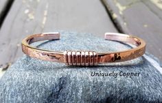 This simple, yet gorgeous copper cuff bracelet is one of my favorites! It is hand forged, hammered, wire wrapped and polished to a brilliant shine. Perfect as a 7th anniversary gift or Mother's Day gift!  SIZING~ To ensure correct sizing, if you don't have a sewing tape measure, simply take a piece of paper and slip it around your wrist to where it is most comfortable to you. Then measure the paper with a ruler, deduct 1 1/4 inches from the measurement for the opening, and you will have your cor Cooper Jewelry, Mens Copper Bracelet, Handmade Copper Bracelet, Stacking Bangles, Sewing Tape Measure, Copper Bracelets, Copper Jewellery, 7th Anniversary Gifts, Copper Diy