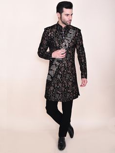 Item contains : Jacket and Pants  Fabrics :    Luxury velvet Colours :  black Style and Designs :  sherwani Indo has mandarin collar and long sleeves with a full button placket asymmetric hem and multiple  slits symmetrical button placket  it has all over resham thread embroidery with shader of golden and brown  Pants or Trousers- Pants boot cut style pants with 2 pockets and a fly on zip and hooks  Size :  Slim fit  Model height is 6 fit and wearing 40 size  Material and Care :  Polyester mix  Only dry clean  Note : There might be minor differences in colours and appearance as a result of photography and lighting  Cut a dash with your personality in your next gathering take this Party House outfit!!  Customise Tailoring Available  We can make your special day dress more special by adding Party Nehru Jacket With Dabka Work, Black Long Sleeve Designer Bandhgala, Long Sleeve Bandhgala For Diwali Party, Party Wear Long Sleeve Bandhgala With Resham Embroidery, Long Sleeve Sherwani For Festive Party, Party Wear Bandhgala With Resham Embroidery And Long Sleeves, Long Sleeve Bandhgala With Resham Embroidery For Party, Festive Long Sleeve Sherwani For Party, Traditional Wear With Zari Work For Winter Reception