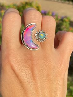 🍭A Bright and Cheerful Celestial Ring 🍬Available in 3 Vibrant Colors of Nova Opal Crescents Pink Magic - Size 9/10 White Rainbow - Size 8/9 Neon Teal Size 7/8 ✨Featuring✨ Sterling Silver Sun Faceted Ethiopian 6mm Opal 🍡This listing is for one ring only🍡 Adjust ring by gently pulling apart or pushing together. Do not use excessive force. It could damage the ring band. Select your choice from the drop down menu 🍭Nova Opals are imitation opals🍭 ☀️Do not submerge in water or chemicals such as Mexican Fire Opal Ring, Pink Magic, Sterling Silver Opal Ring, Celestial Ring, Silver Opal Ring, Fire Opal Ring, White Rainbow, Sterling Silver Cuff, One Ring