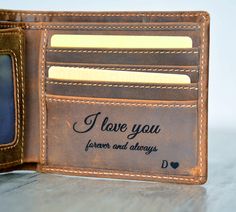 a leather wallet with i love you forever and always written on the front card pocket