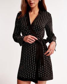 Flattering long-sleeve mini dress in our drapey synthetic fabric, featuring a v-neckline with classic collar, crossover bodice detail and a self-tie wrap skirt. Female Features, Female Design, Wrap Mini Dress, Tie Wrap, Long Jumpsuits, Style And Grace, Mini Wrap Dress, Long Sleeve Mini, Black Dots