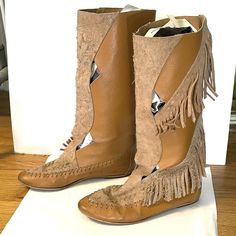 "Vintage 70s bohemian fringe suede leather knee-high mid calf flat moccasin boots made in Spain.  Tan camel with cut outs.  Good condition with a few minor marks.  Sold as is. Says 8.5 but fits more like 7-7.5 us Feet 9-95\" should work best. Final sale, consider this a virtual yard sale!" Bohemian Knee-high Leather Boots, Bohemian Brown Suede Boots, Bohemian Suede Boots With Tassels, Casual Leather Fringe Boots, Brown Fringe Boots For Festival, Festival Leather Fringe Boots, Bohemian Style Fringe Suede Boots, Bohemian Suede Fringe Boots, Bohemian Suede Boots With Fringe