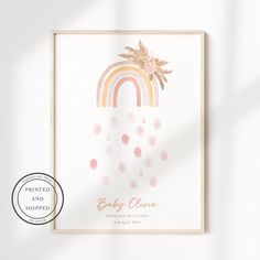 a baby shower with pink and gold confetti hanging from it's side