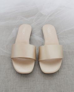 Classic slide flat sandals for casual and dressy look. Simple and easy wear for brides, bridesmaids and wedding parties.DETAILS:COLORS AVAILABLE: Ivory, Light Blue, White, Pink, and ChampagneUPPER: Synthetic upper and liningMATERIALS: Mandmade outsole STYLE NAME: EVELYN Bridesmaids Sandals, Name Evelyn, Sandals Glitter, Bridesmaid Sandals, Shoes For Brides, Low Block Heel Sandal, Pearl Sandals, T Strap Flats, Embellished Flats