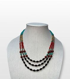 Step into the world of boho chic with our Bohemian Dreams Handcrafted Beaded Multi-Strand Necklace, a perfect blend of free-spirited style and elegance. Features: Intricate Beadwork: Black, red, turquoise, and golden beads are thoughtfully arranged to create a vibrant, captivating design. Adjustable Length: The necklace features an adjustable hook clasp, allowing you to customize the length for any outfit or occasion. Versatile Style: Ideal for both casual and formal wear, this statement piece complements a wide range of looks. Artisan Craftsmanship: Handcrafted by skilled artisans, each necklace is a testament to their dedication and attention to detail. Size & Material: Material: High-quality beads with a sturdy link chain Style: Multi-strand, adjustable length Care Instructions: Store i Artisan Black Beads Necklace For Festival, Bohemian Black Beads Jewelry For Festivals, Bohemian Black Beaded Jewelry For Festivals, Bohemian Festive Beaded Necklace With Large Beads, Bohemian Beaded Necklaces With Large Beads For Festive Occasions, Bohemian Beaded Chain For Festive Occasions, Bohemian Beaded Chain Beads For Festive Occasions, Bohemian Black Beaded Necklaces For Festivals, Bohemian Black Beaded Necklace For Festivals