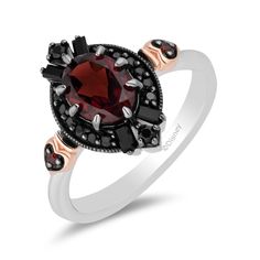 Diabolically enduring, this Evil Queen diamond, onyx and garnet ring offers the mesmerizing mystique and mirrored madness Her Majesty embodies. One cunning red oval-shaped natural garnet, 14 round brilliant cut black diamonds and four baguette-shaped onyx rest in sterling silver with black rhodium plating. Two round red garnets rest on either side in rose gold heart shaped settings with black rhodium prongs for added dimension. Deeply alluring with endless envy, the scintillation offered is no t Goth Wedding Ring, Disney Evil Queen, Queen Rings, Egirl Fashion, Enchanted Disney, Enchanted Disney Fine Jewelry, Disney Fine Jewelry, Sterling Silver Garnet Ring, Goth Model