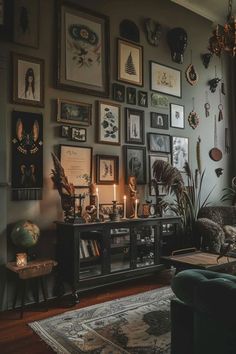 a living room filled with lots of pictures and candles on the wall next to a couch