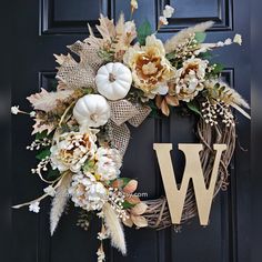 a wreath that has the letter w on it