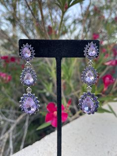 Purple Rhinestone Crystal Earrings For Party, Purple Party Earrings With Sparkling Stones, Party Purple Crystal Rhinestone Earrings, Purple Crystal Earrings For Wedding, Elegant Lavender Crystal Earrings For Party, Purple Crystal Drop Earrings For Evening, Purple Drop Crystal Earrings For Evening, Purple Sparkling Stones Earrings For Party, Unique Purple Jeweled Dangle Jewelry