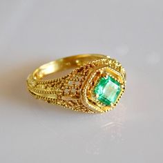 Exquisite geometric avant garde 18k solid Gold Emerald Ring. Material: 18k solid Gold Stone: Pristine AAA+ grade natural Columbian Emerald All our Stones are Ethically sourced. Made with Love at our Temple Jewels studio in ibiza. Custom orders Welcomed! Free world wide shipping. Sizing included For more rings: https://www.etsy.com/shop/templejewelsibiza/items?section_id=21449468 To my shop: https://www.etsy.com/shop/templejewelsibiza Exquisite 14k Gold Emerald Ring, Antique 14k Gold Emerald Ring, Elegant 14k Gold Multi-stone Emerald Ring, 14k Gold Emerald Ring With 17 Jewels - Collectible, 14k Gold Green Emerald Ring, Fine Jewelry, Gold Emerald Ring, New Saree Blouse Designs, Columbian Emeralds, Emerald Ring Gold