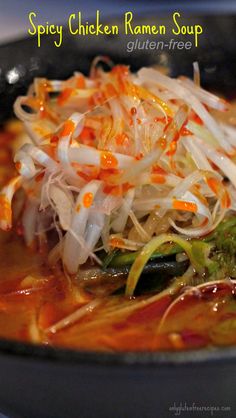 a close up of a bowl of food with broccoli and shredded carrots