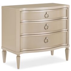 an antique style dresser with three drawers and two knobs on the bottom, in beige