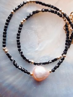 Immerse yourself in luxury with our exquisite gemstone necklace, featuring a lustrous pink freshwater pearl. Embellished with dazzling gemstones and delicate gold beads, each necklace evokes a sense of elegant paradise. ✦ Choose your Gemstone and Adjustable Length ✦ ✦ DETAILS ✦✧ Name: Akala (ah KAH la) - Pink.✧ All golden components 14kt Gold Filled.✧ Genuine Gemstones.✧ Natural Pink Freshwater Pearl.✧ Due to the nature of the gemstones and pearl, each piece may vary from the photos in size/color/shape. Every piece is gorgeous and unique.✧ All Ke Aloha Jewelry pieces come packaged thoughtfully, beautifully, and ready for gift giving.✧ Unless otherwise noted in the listing description, all pieces are sold individually. Photos with models/multiple pieces are for style inspiration only. Unique Choker Necklaces, Unique Choker, Dainty Gemstone Necklace, Floating Pearl Necklace, Gemstone Choker Necklace, Hawaii Jewelry, Turquoise Choker, Pink Pearl Necklace, Amazonite Necklace